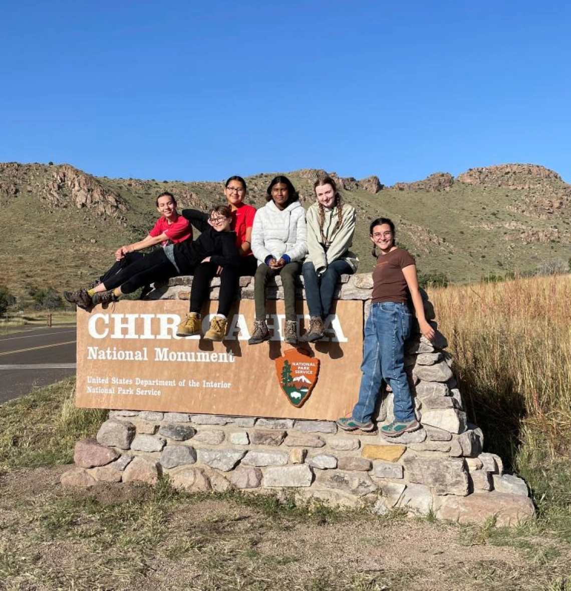 GALS posing by the chiricahua national monument sign