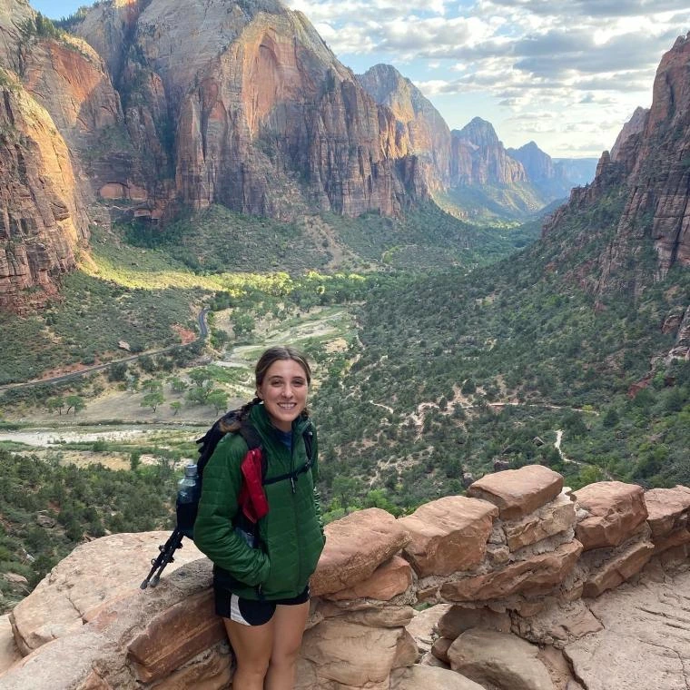 maddie in front of a valley